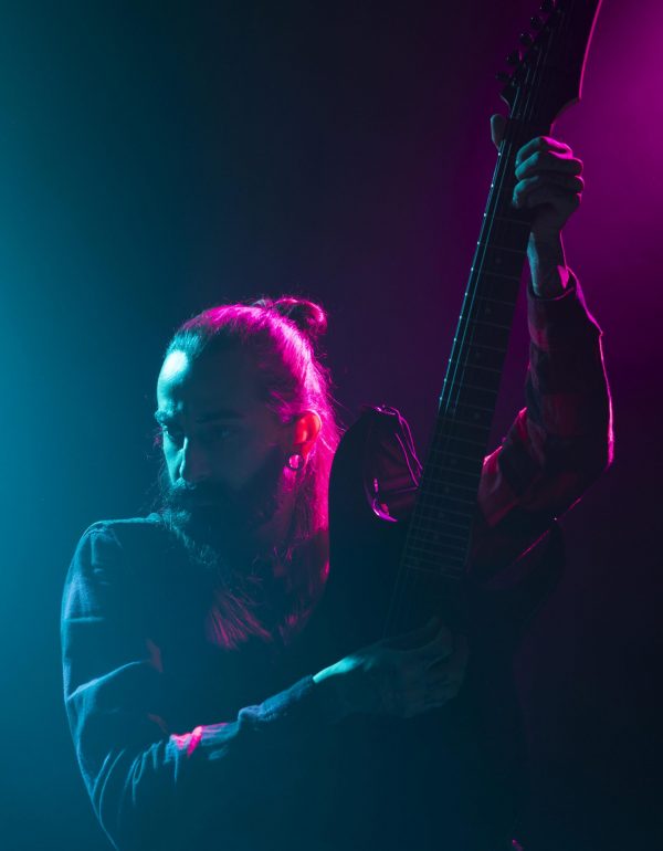 artist-playing-guitar-stage-medium-shot
